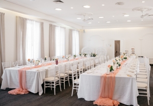 The Palm Room is a wedding venue that features an indoor dining area and adjoining balcony space